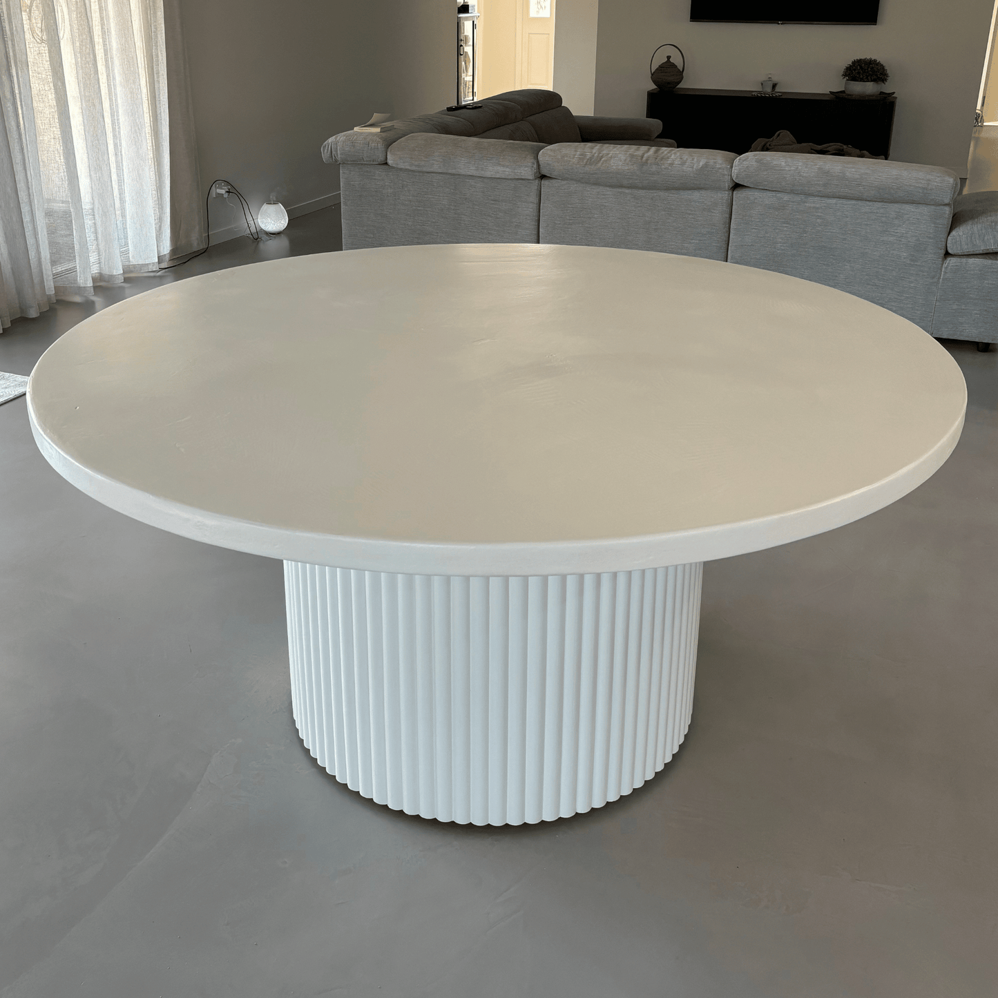 microcement white round dining
