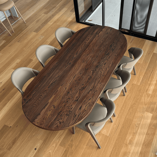 American oak dining table in dark roast, styled with dining chairs