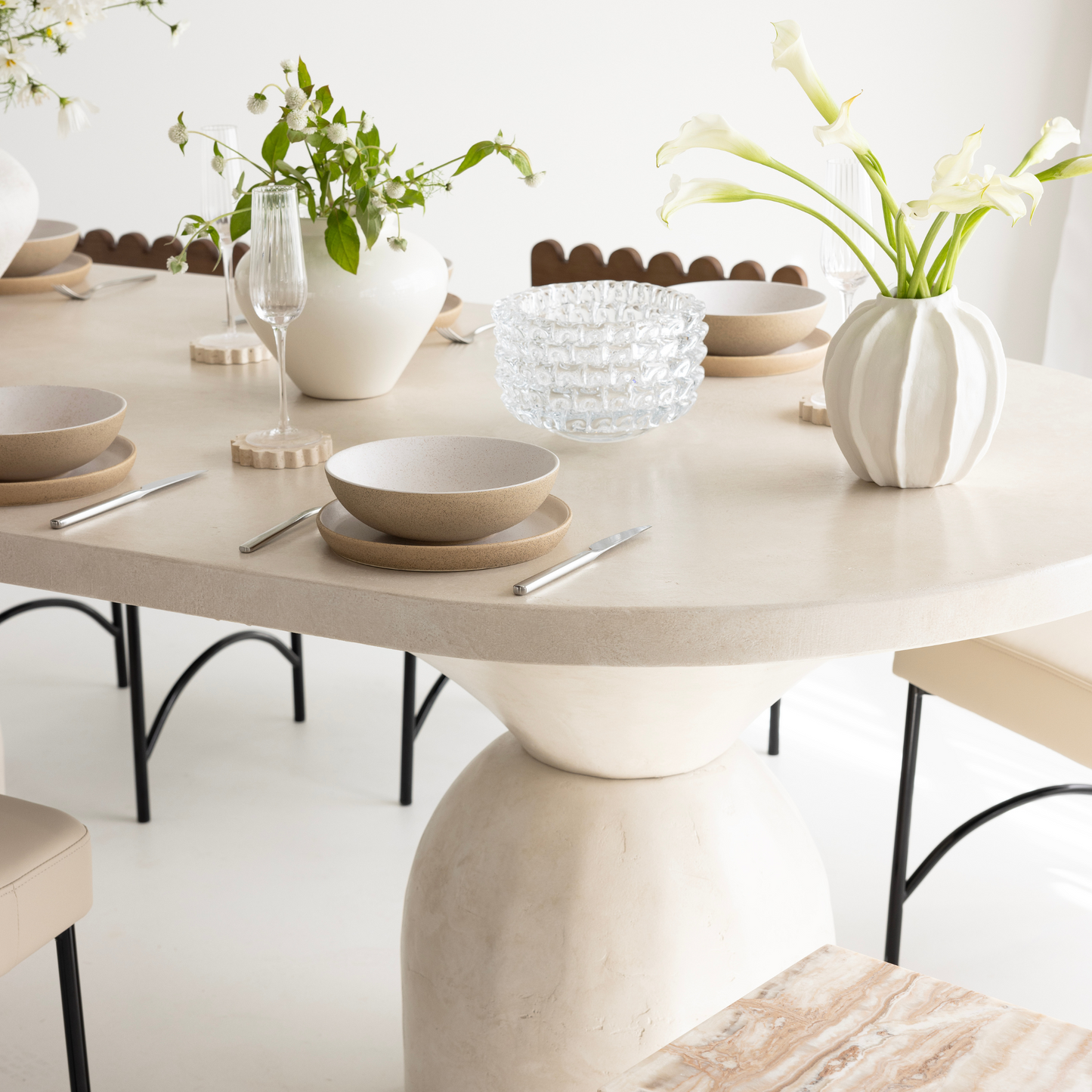 lotus dining table in sand stonewash close up with tableware