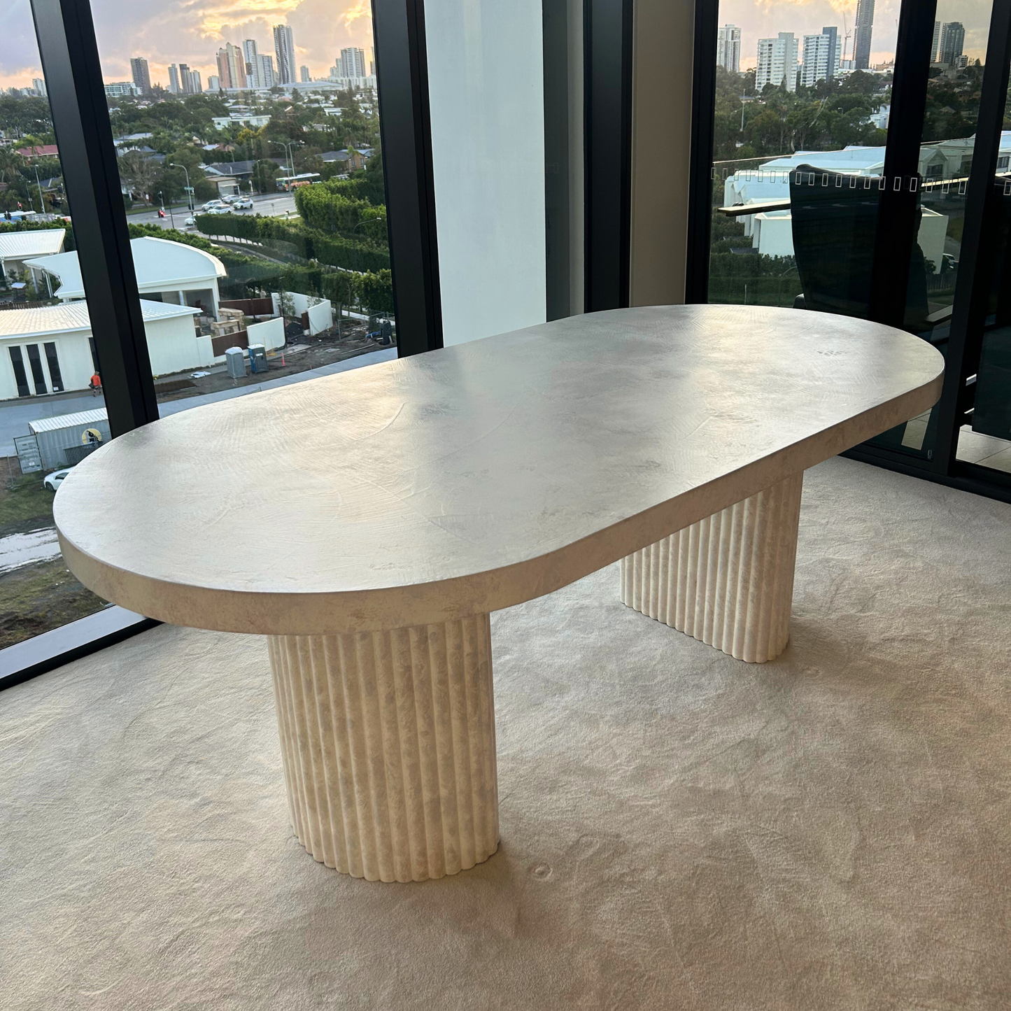 crescent leg oval dining in beige stonewash