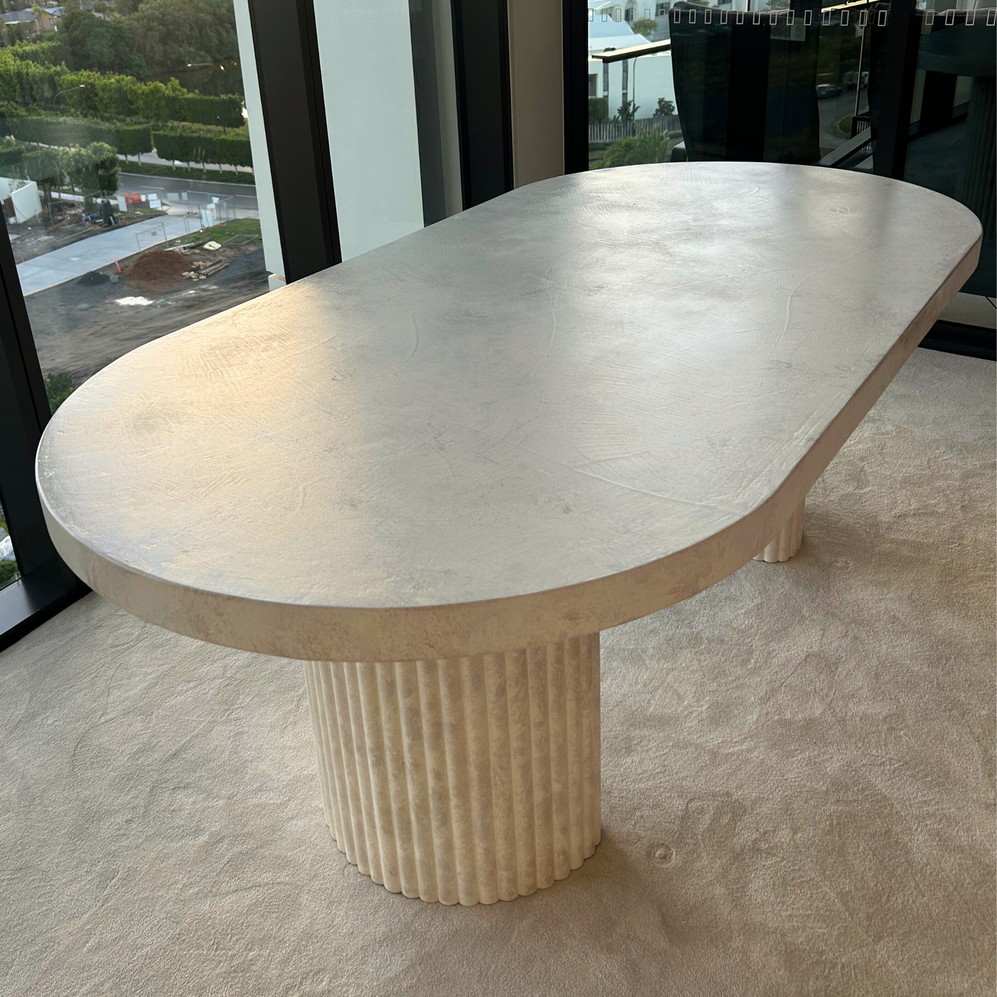 crescent oval beige stonewash table