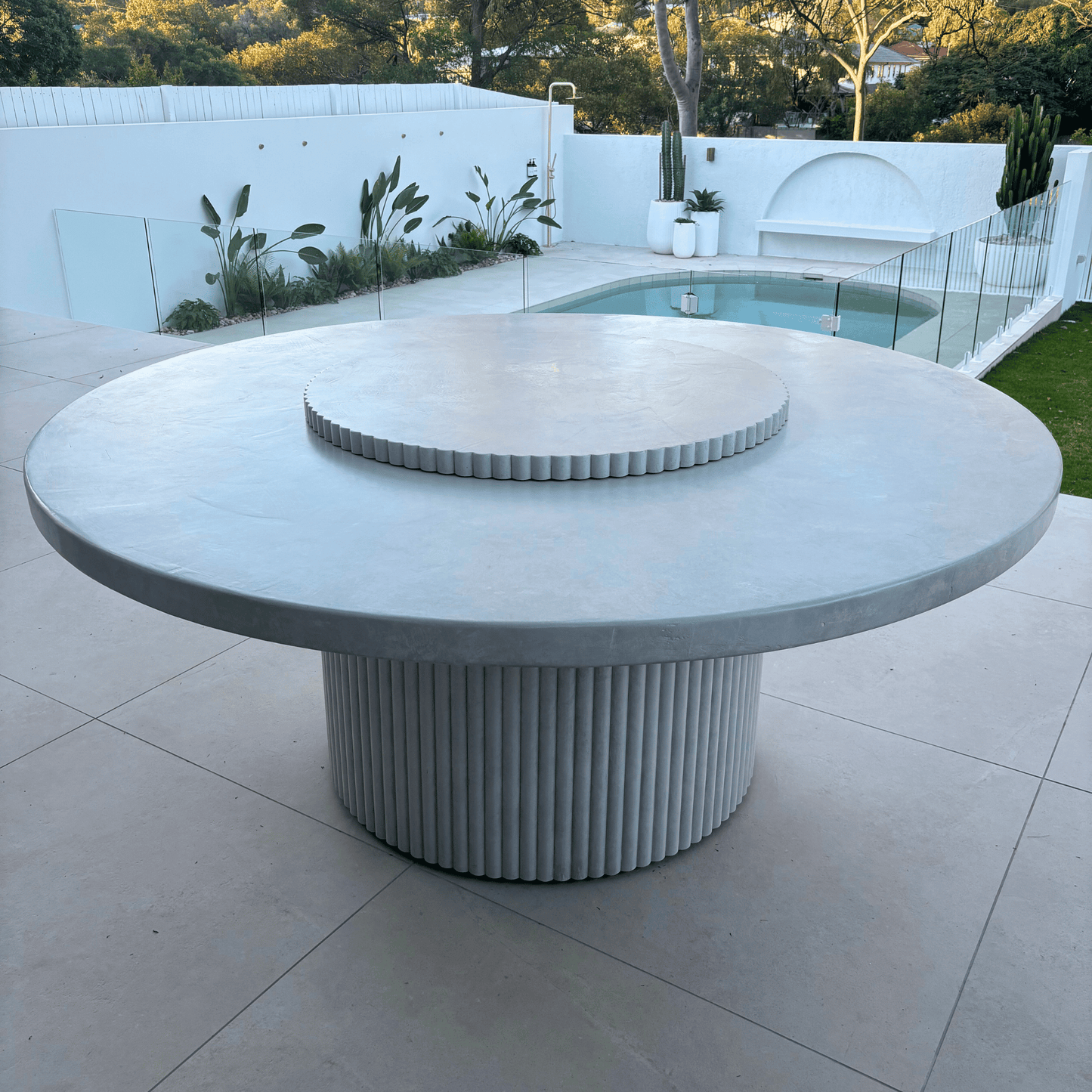 albany round fluted dining table in light stonewash