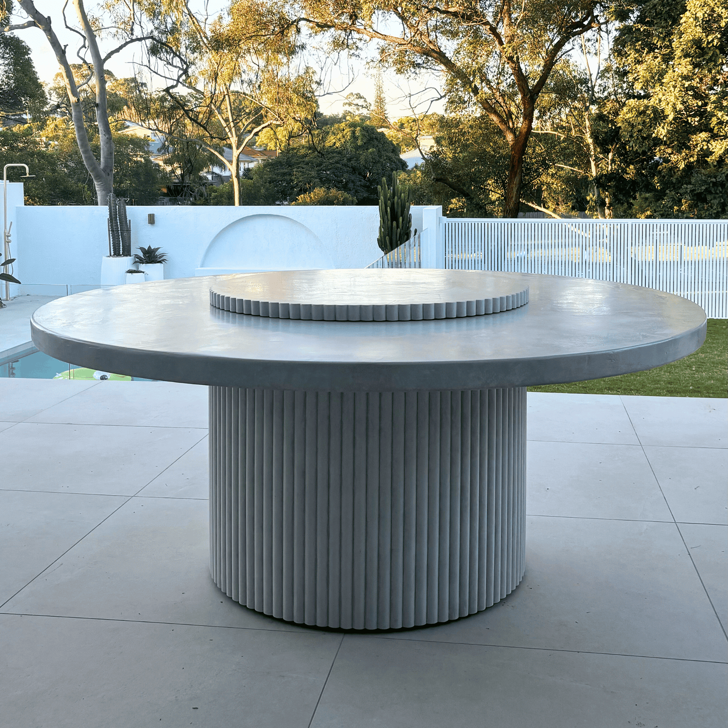 albany round fluted dining table in light stonewash