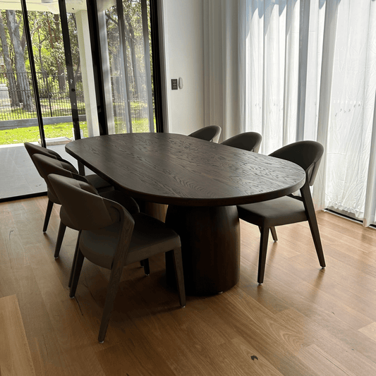 American oak dining table in dark roast, styled with dining chairs