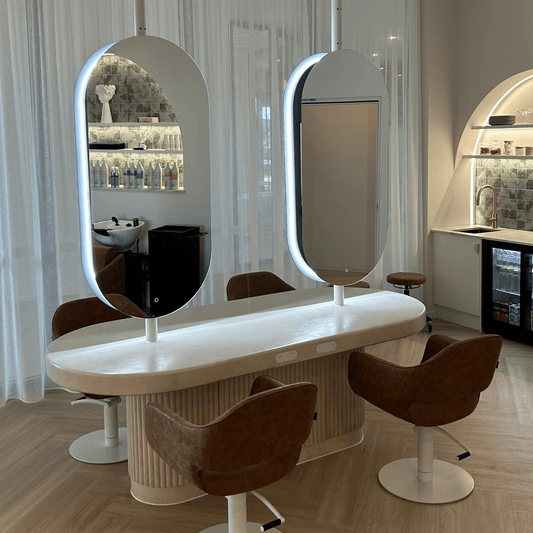 Salon setup with a hairdressing station, mirrors, and chairs.