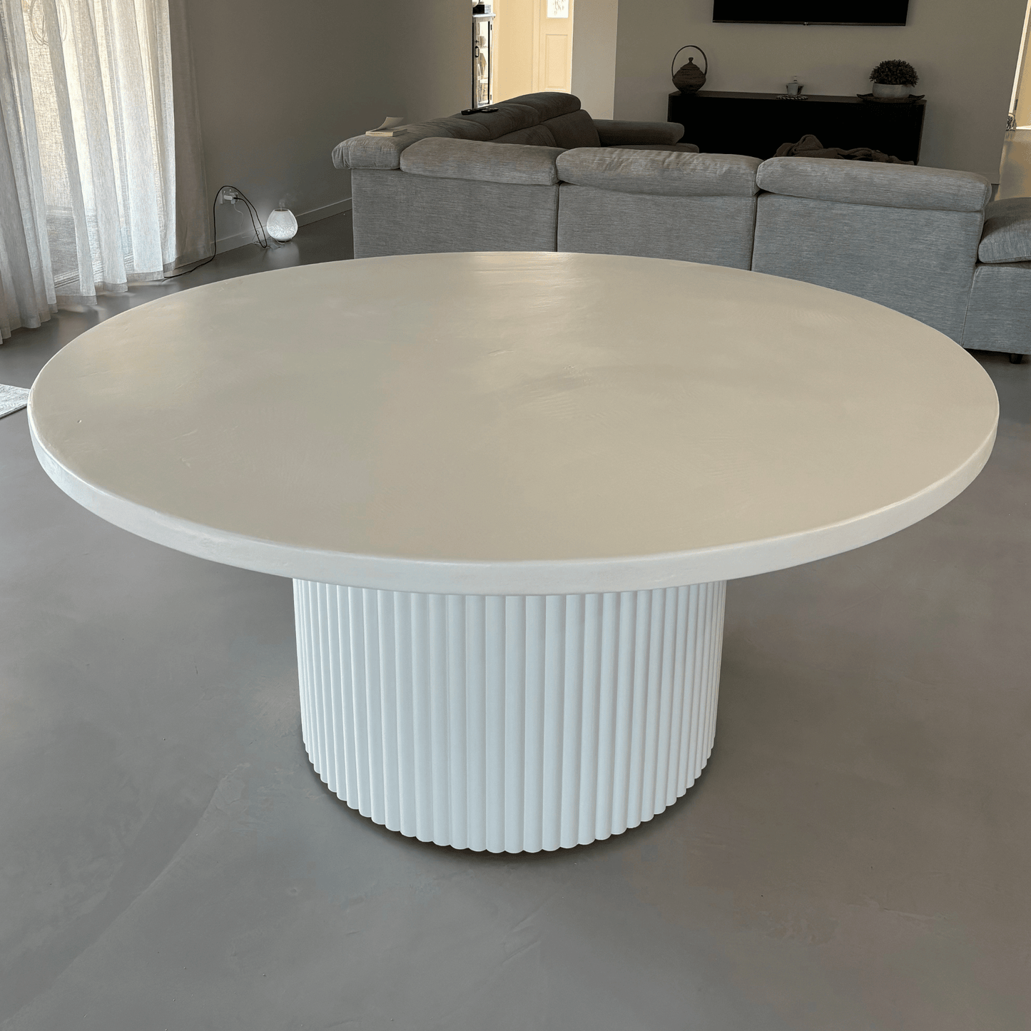 microcement white round dining

