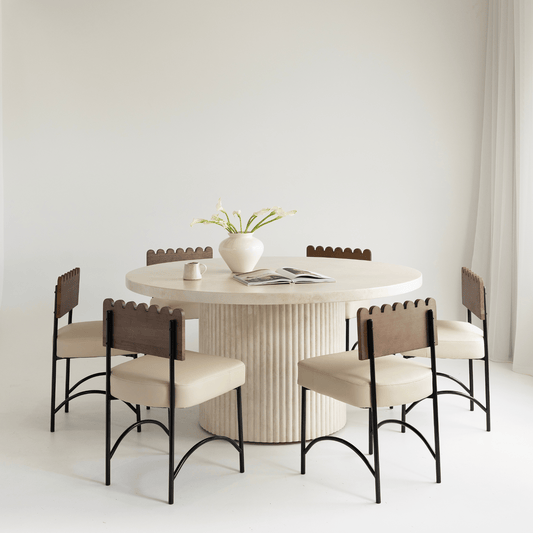 albany round fluted dining table in sand, styled with chairs