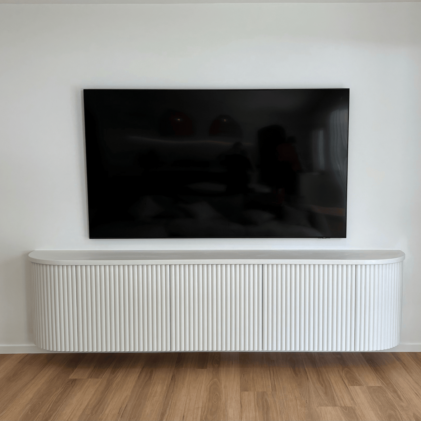 white fluted curved entertainment unit
