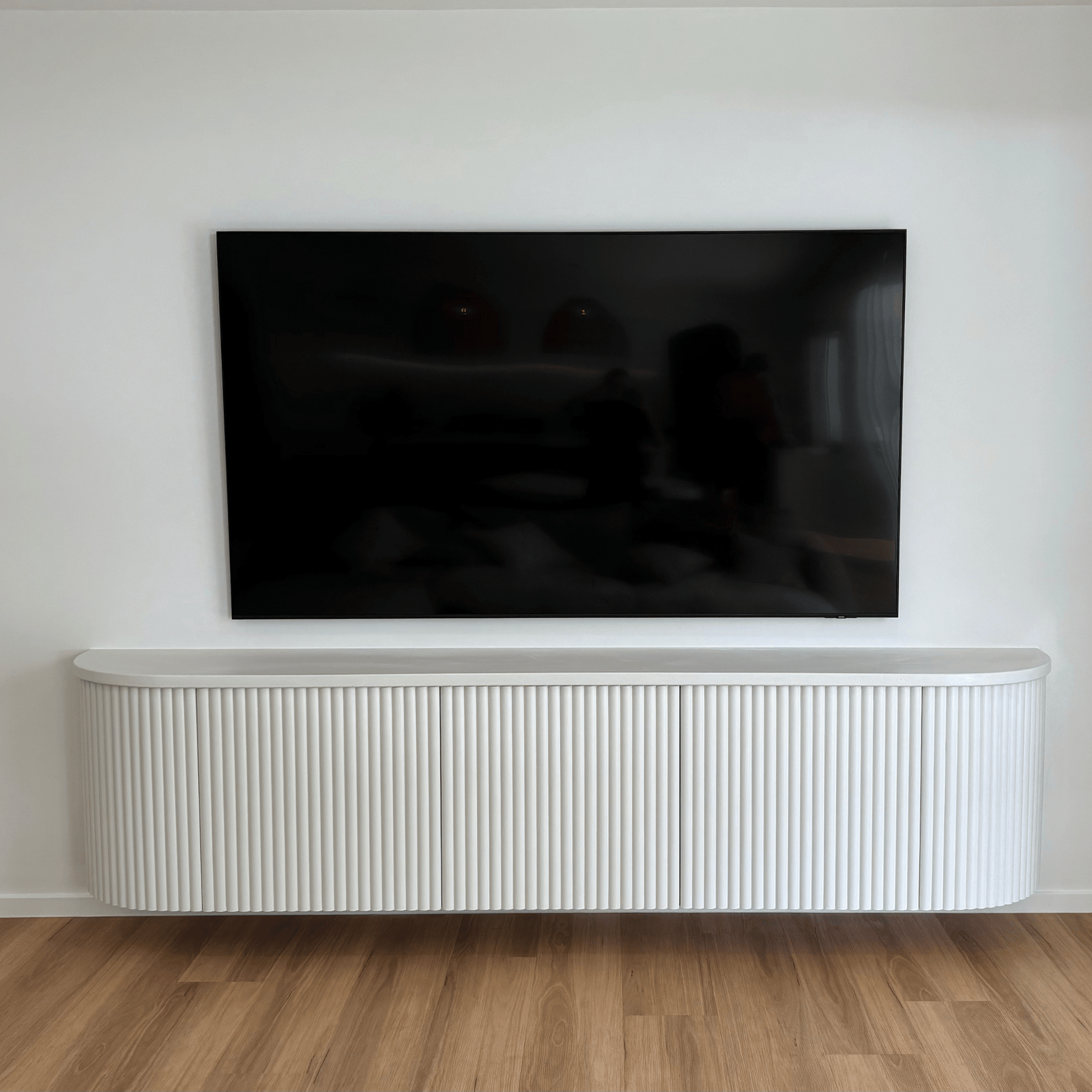 white fluted curved entertainment unit