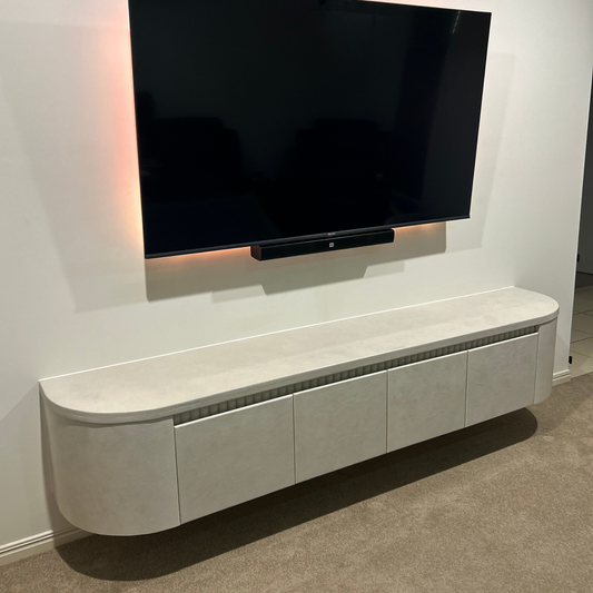 curved entertainment unit with ribbed detail