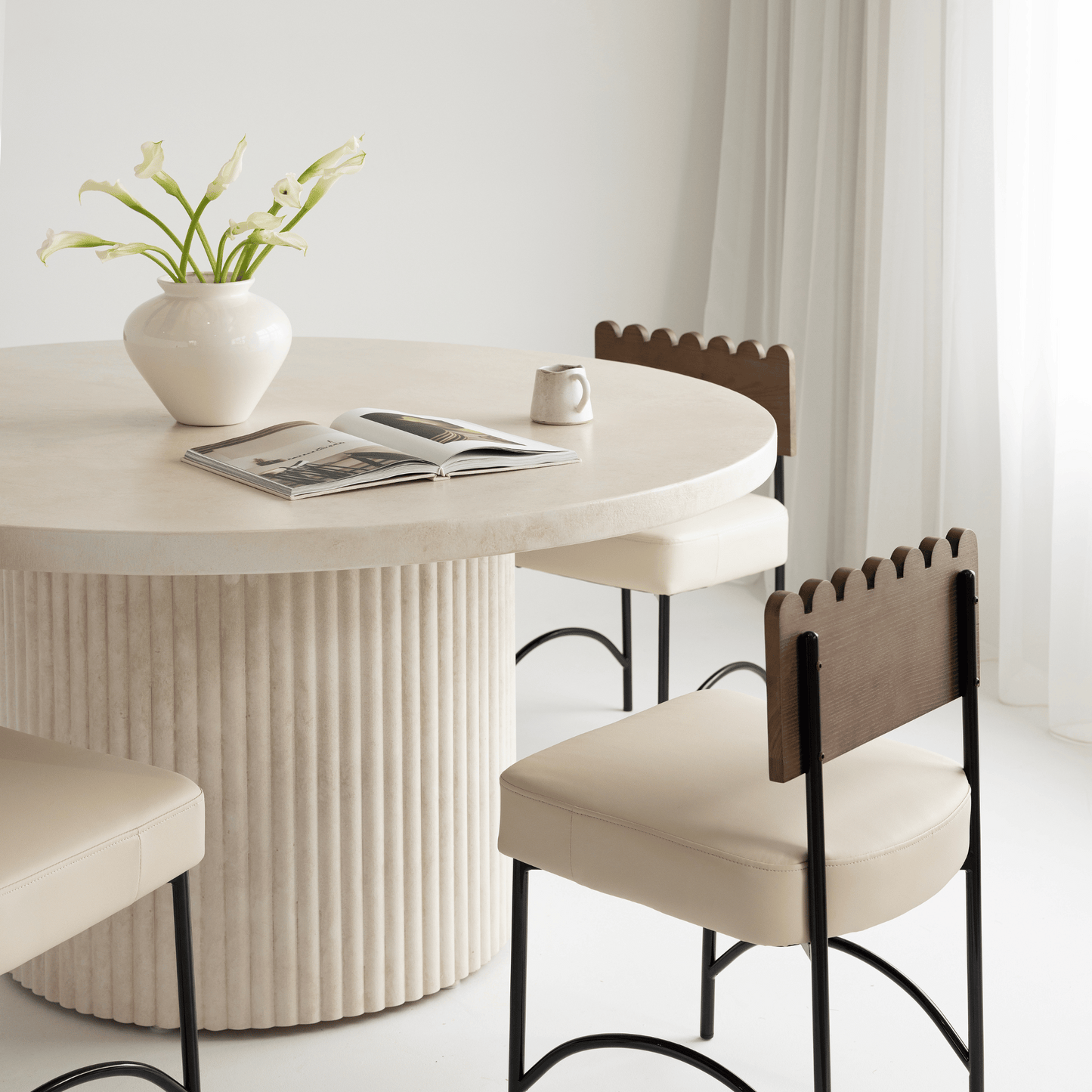 Albany round dining table styled with Onyx beige chairs