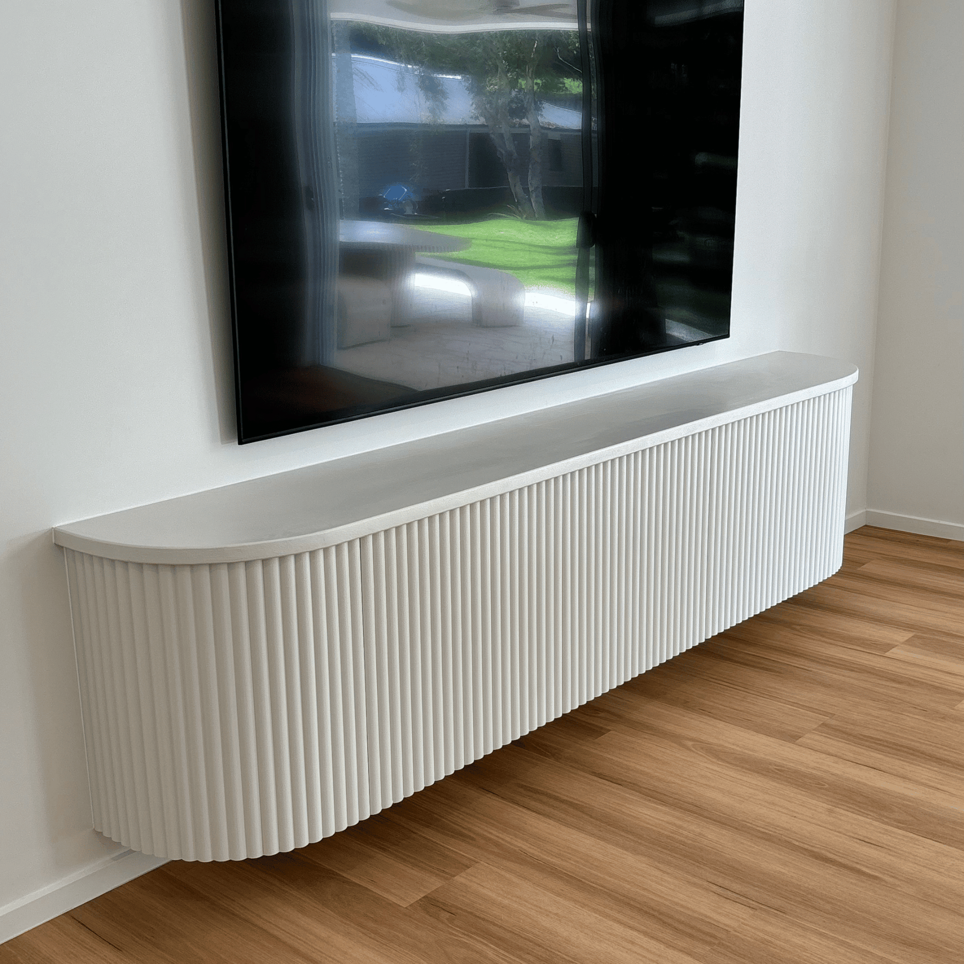 white fluted curved entertainment unit