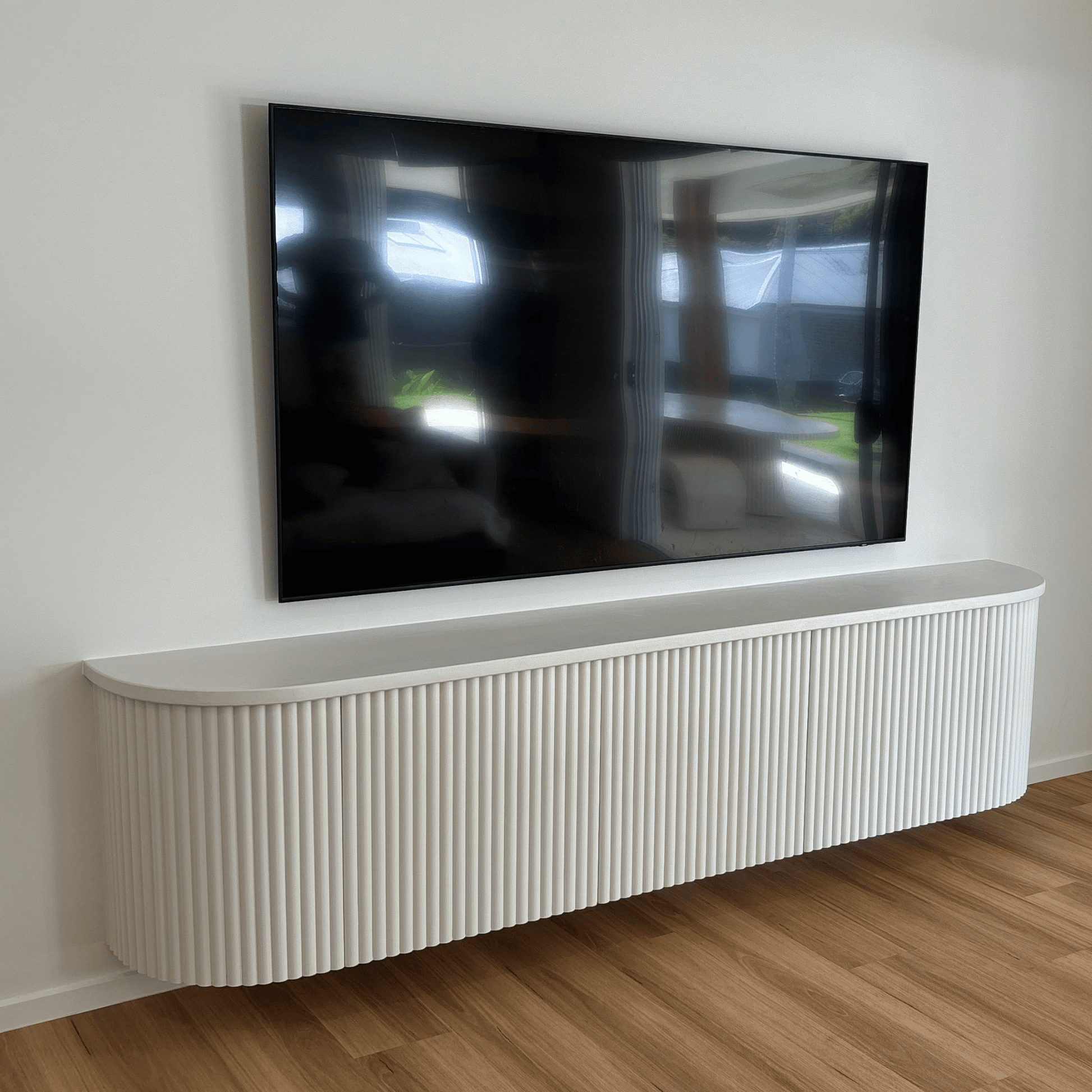 white fluted curved entertainment unit