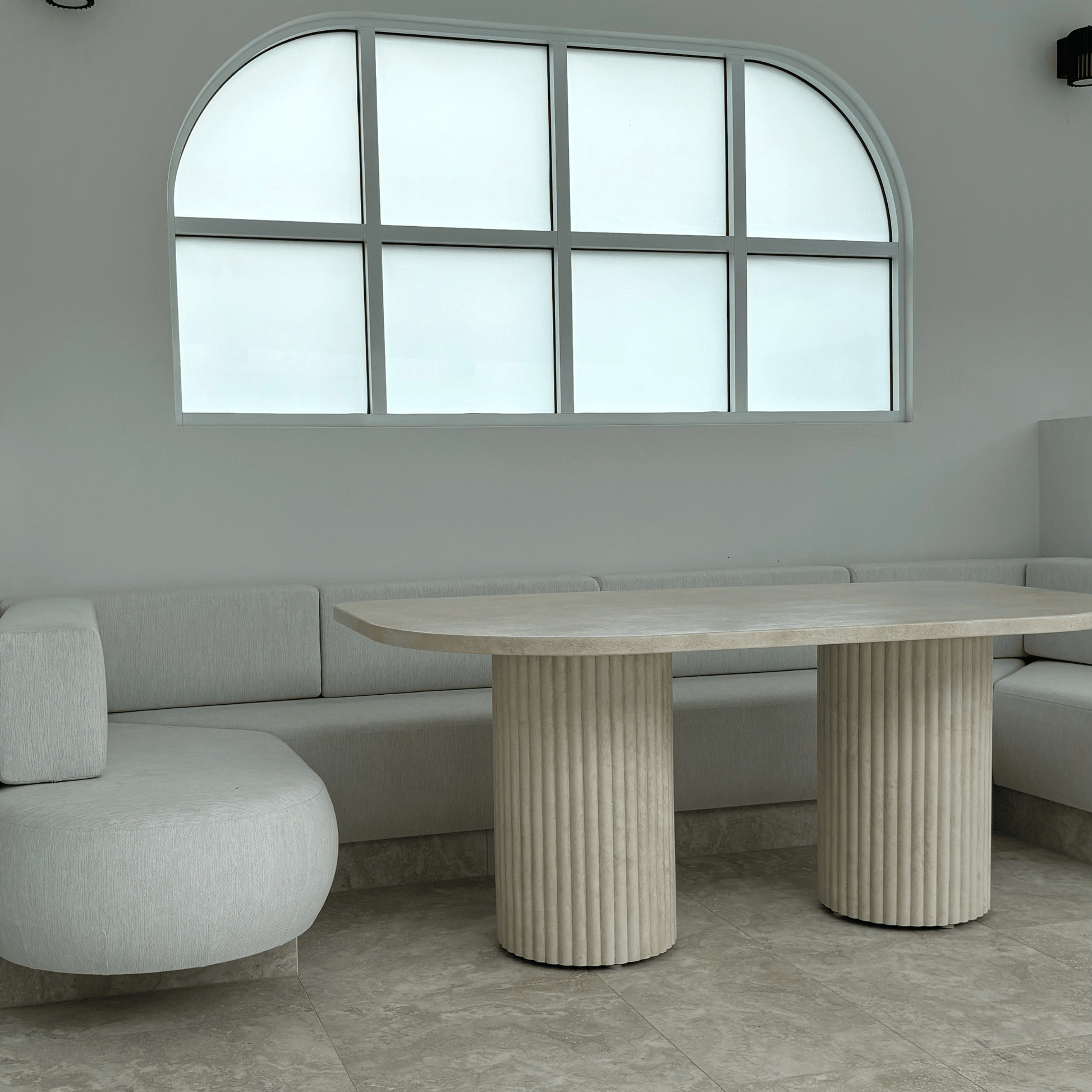 arch dining table in sand stonewash