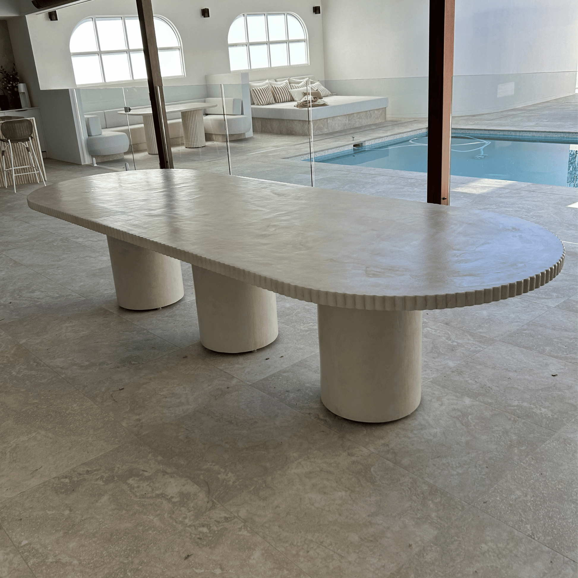ribbed edge smooth pillar table with three legs