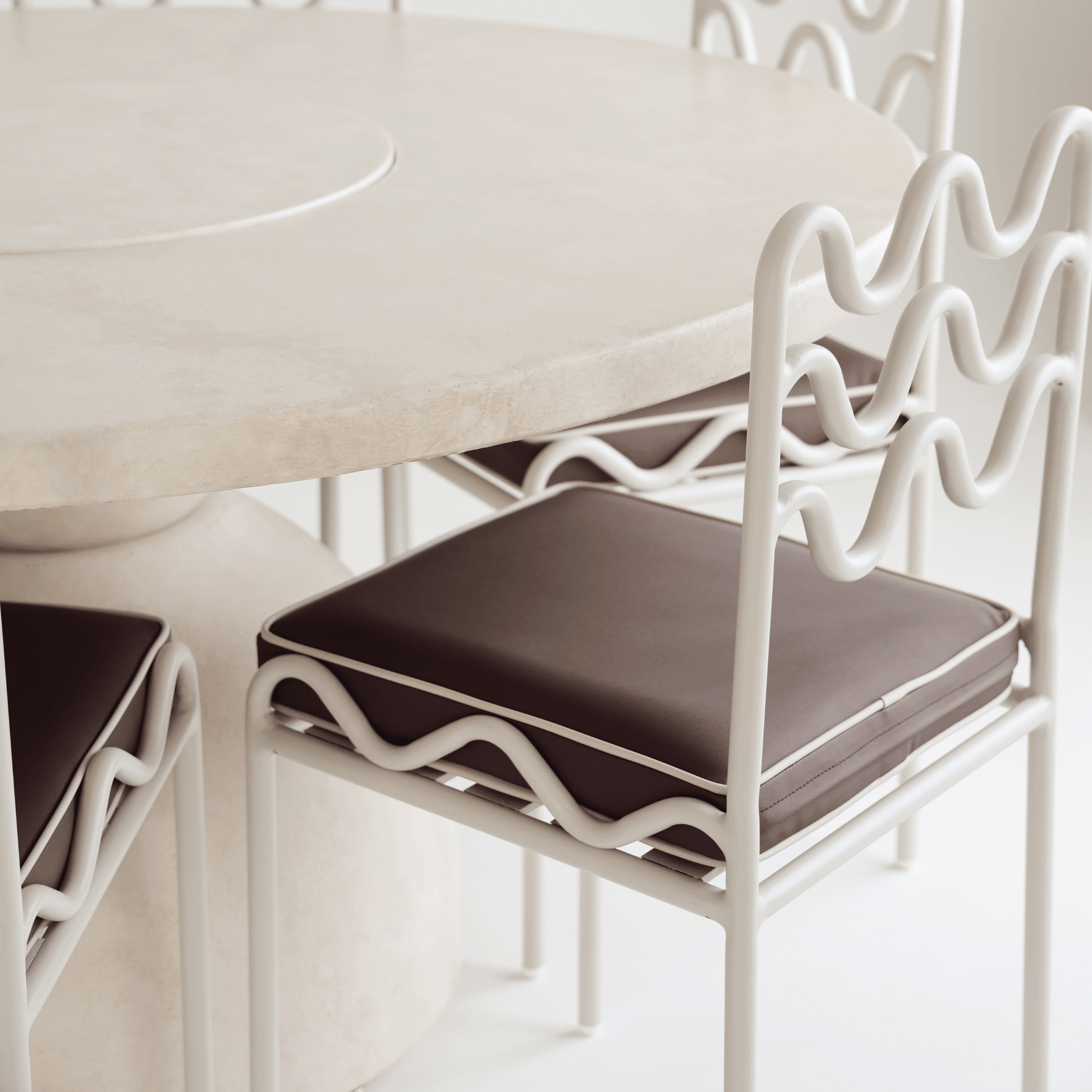 detail image of Lotus tabletop edge with chairs