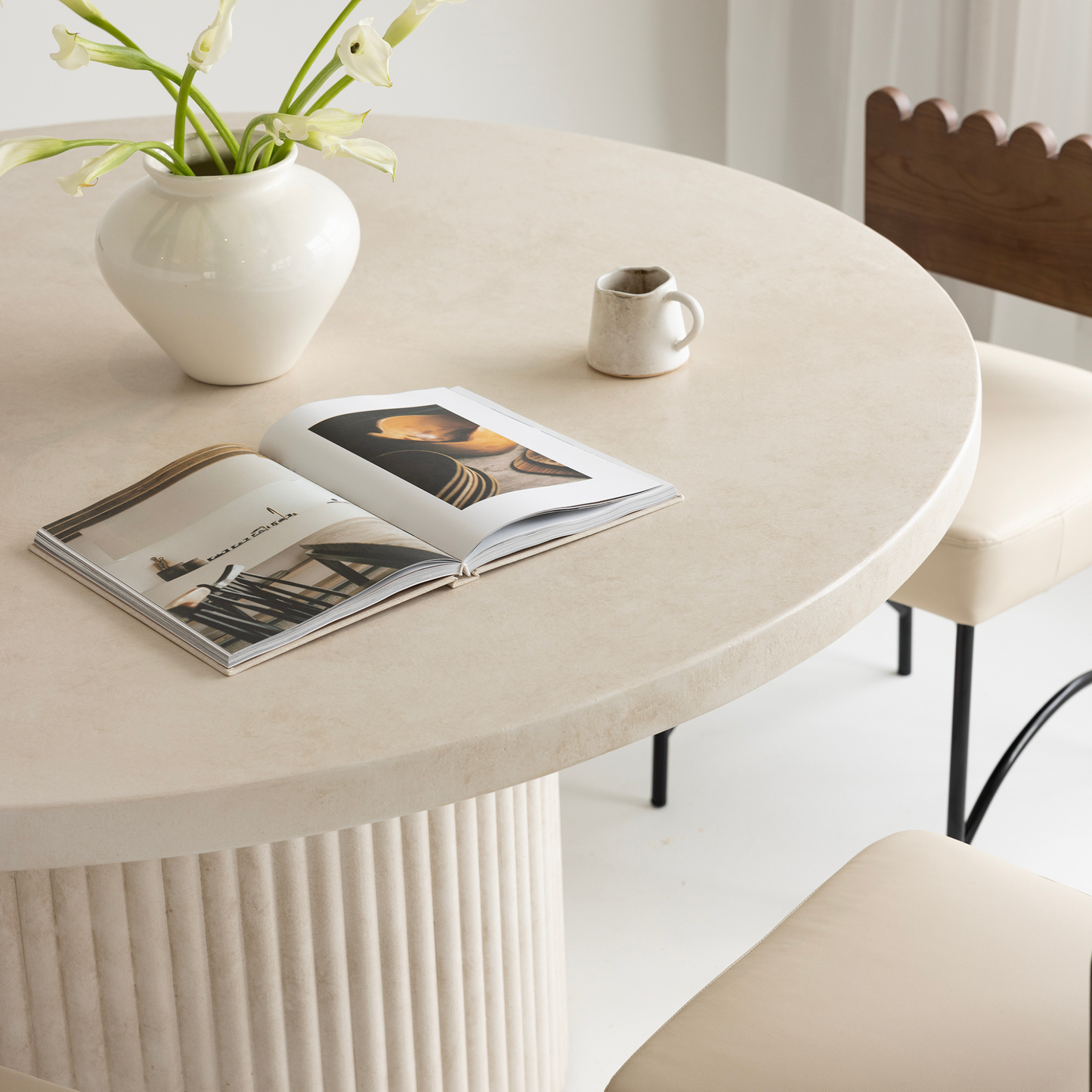Albany round dining table styled with Onyx beige chairs