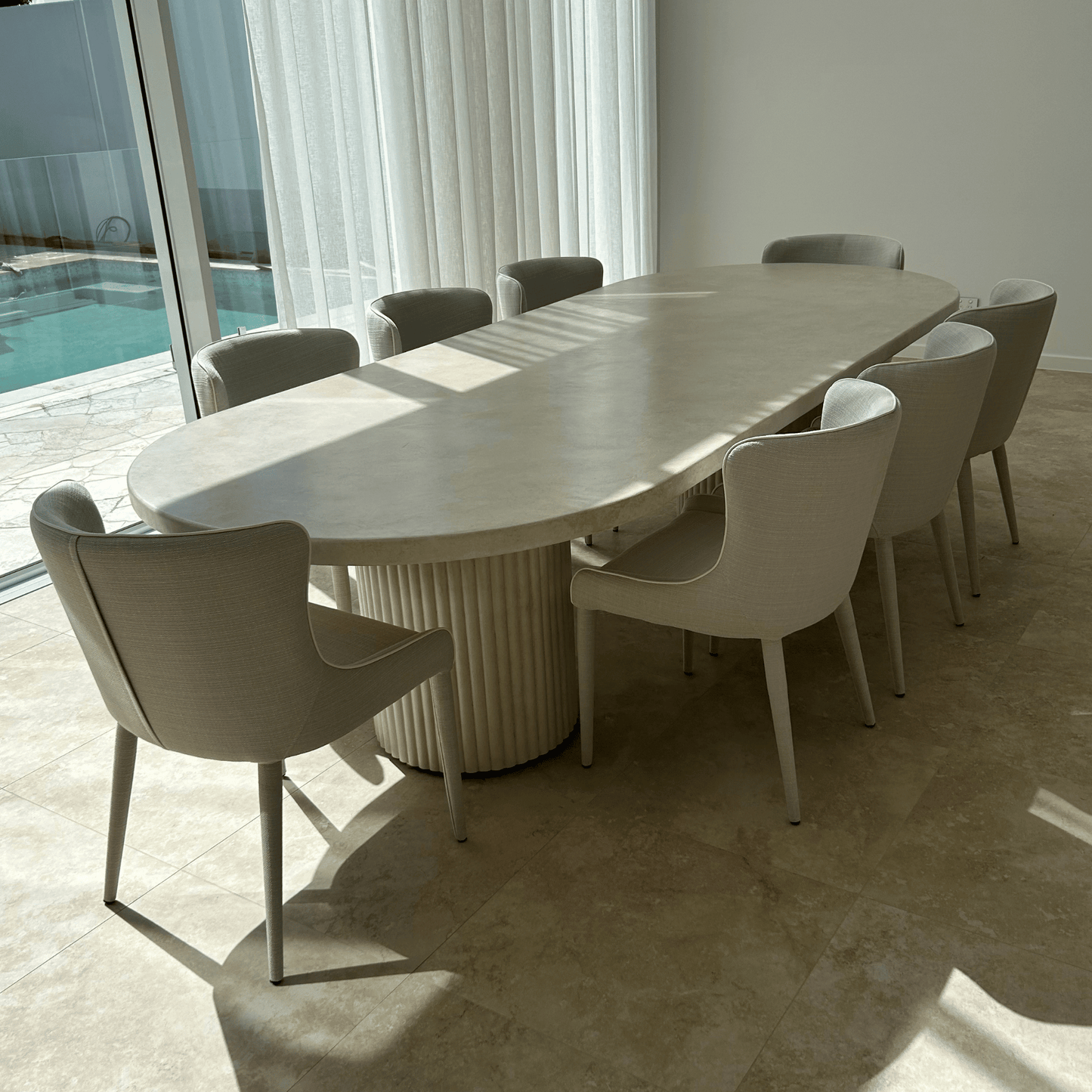 bilinga fluted pillar oval dining table in sand