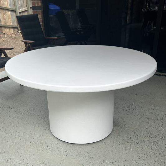 white microcement round smooth table